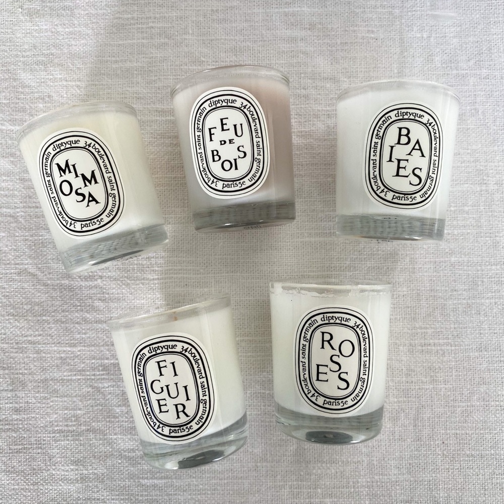 Set of 5 mini unused Diptyque candles.